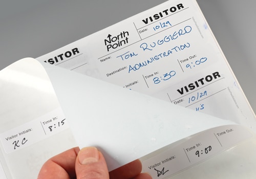 A complete duplicate record of their visit remains hidden behind the label backing.